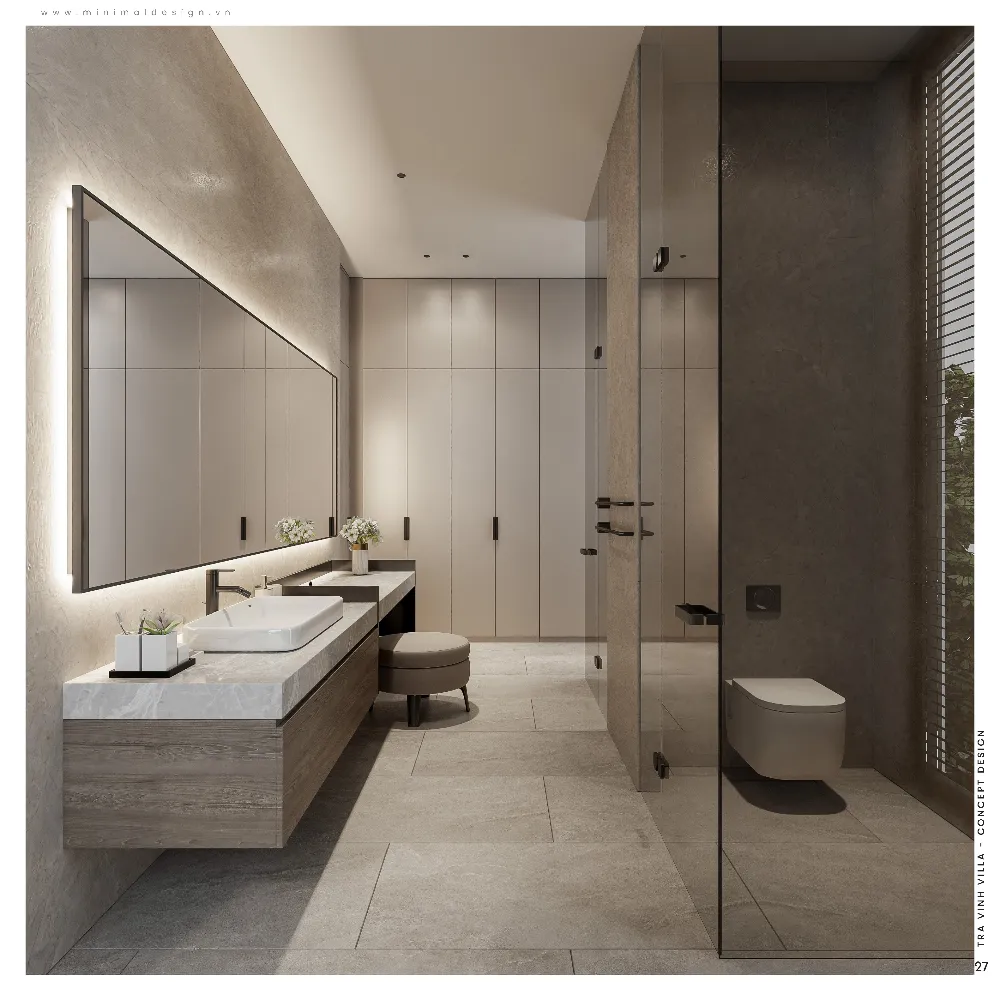 Phòng tắm villa tối giản xanh sử dụng đá, kính và ánh sáng gián tiếp